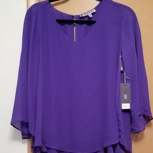 Jennifer Lopez purple dressy shirt